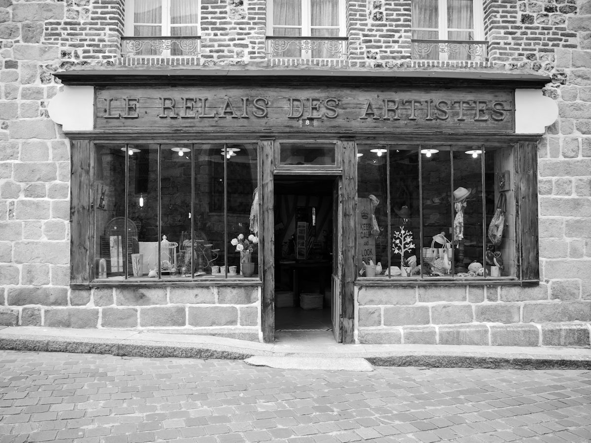 a black and white photo of a store front