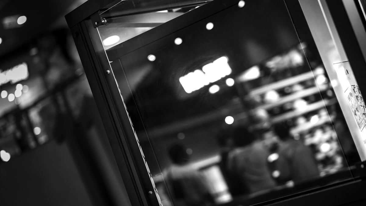 a black and white photo of a store window