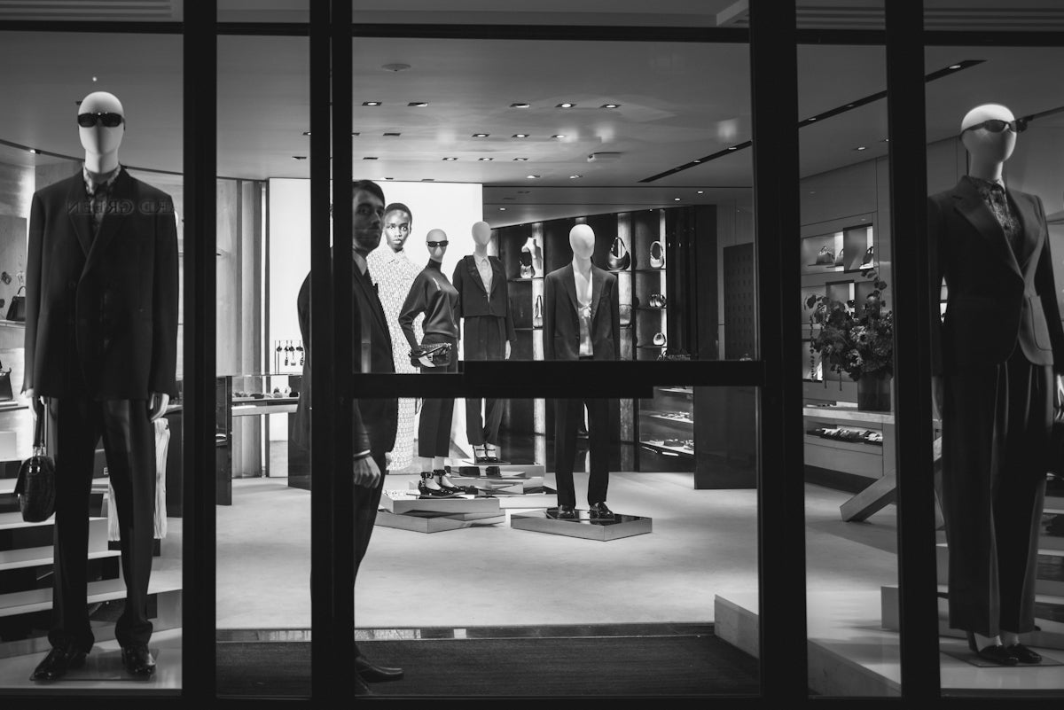 a group of mannequins in a store window