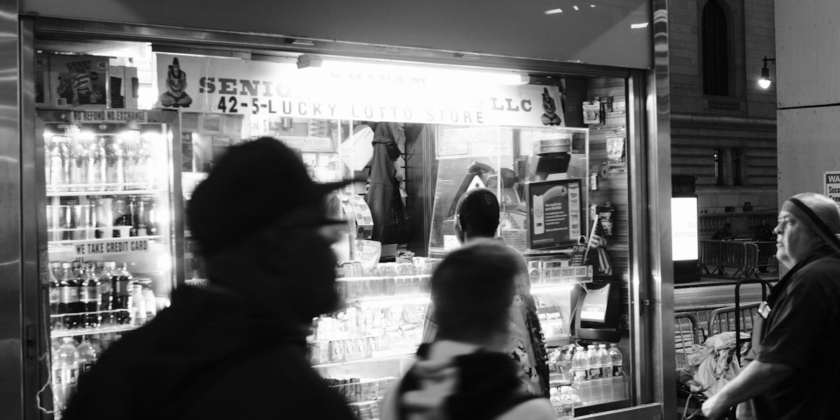 A group of people standing around a store