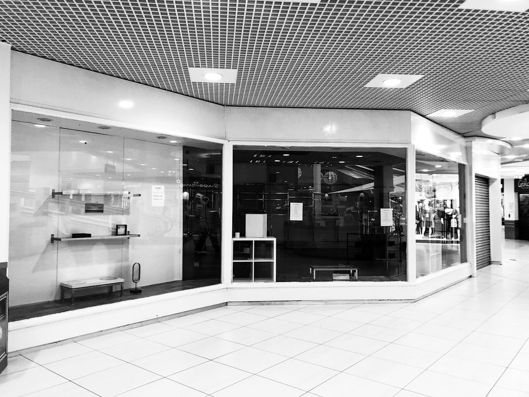 grayscale photo of glass door