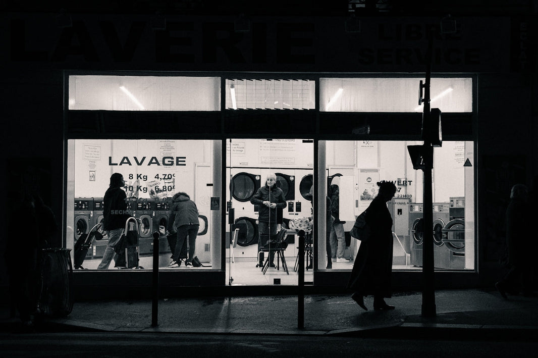 a black and white photo of a store front