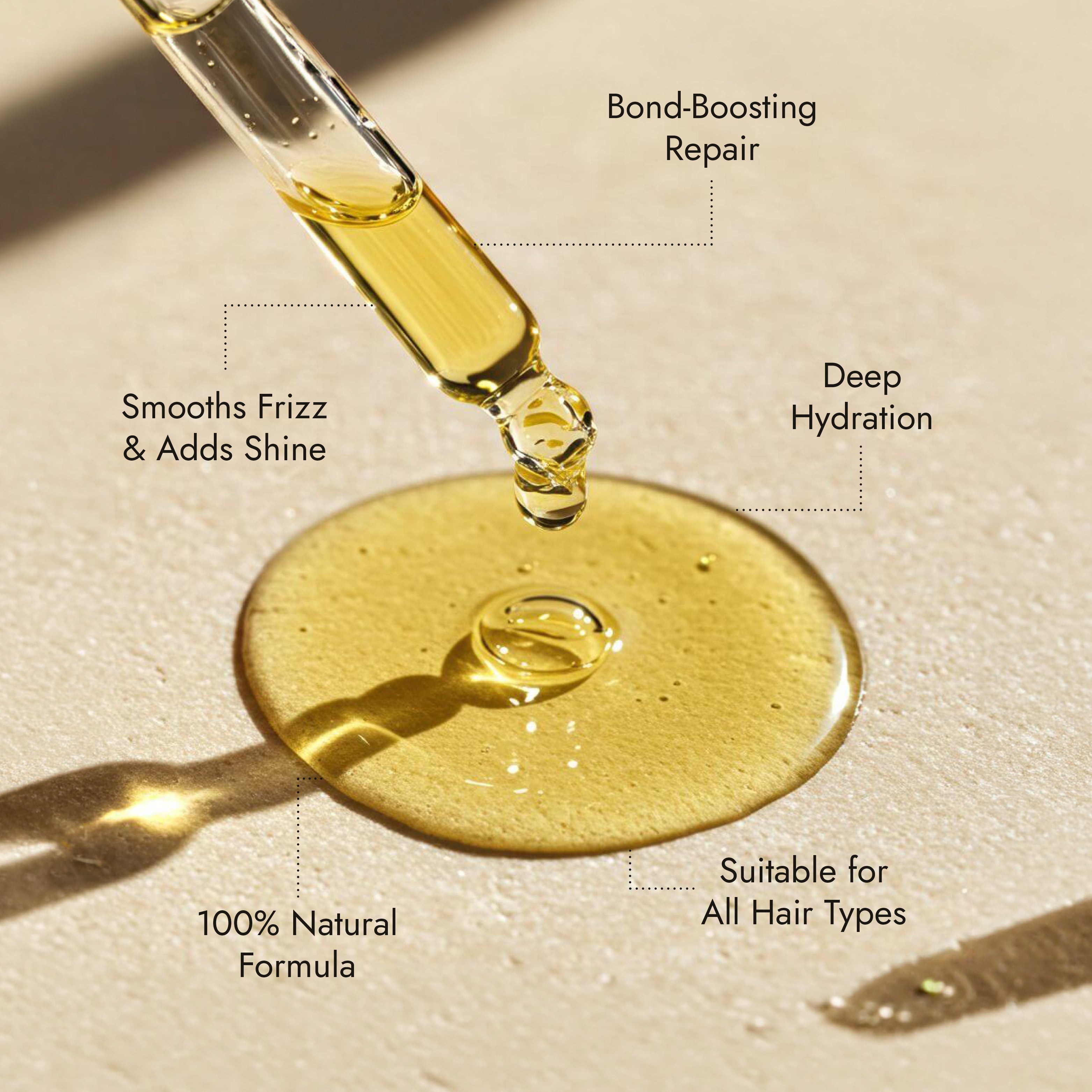 Rosemary hair oil bottle with dropper on a stone surface with natural light. Rosemary hair oil, argan, almond, bond, boost, hair growth, coconut oil, healthier, fuller-looking hair, stimulate, regrowth, hair thinning, natural, 100ml, benefits