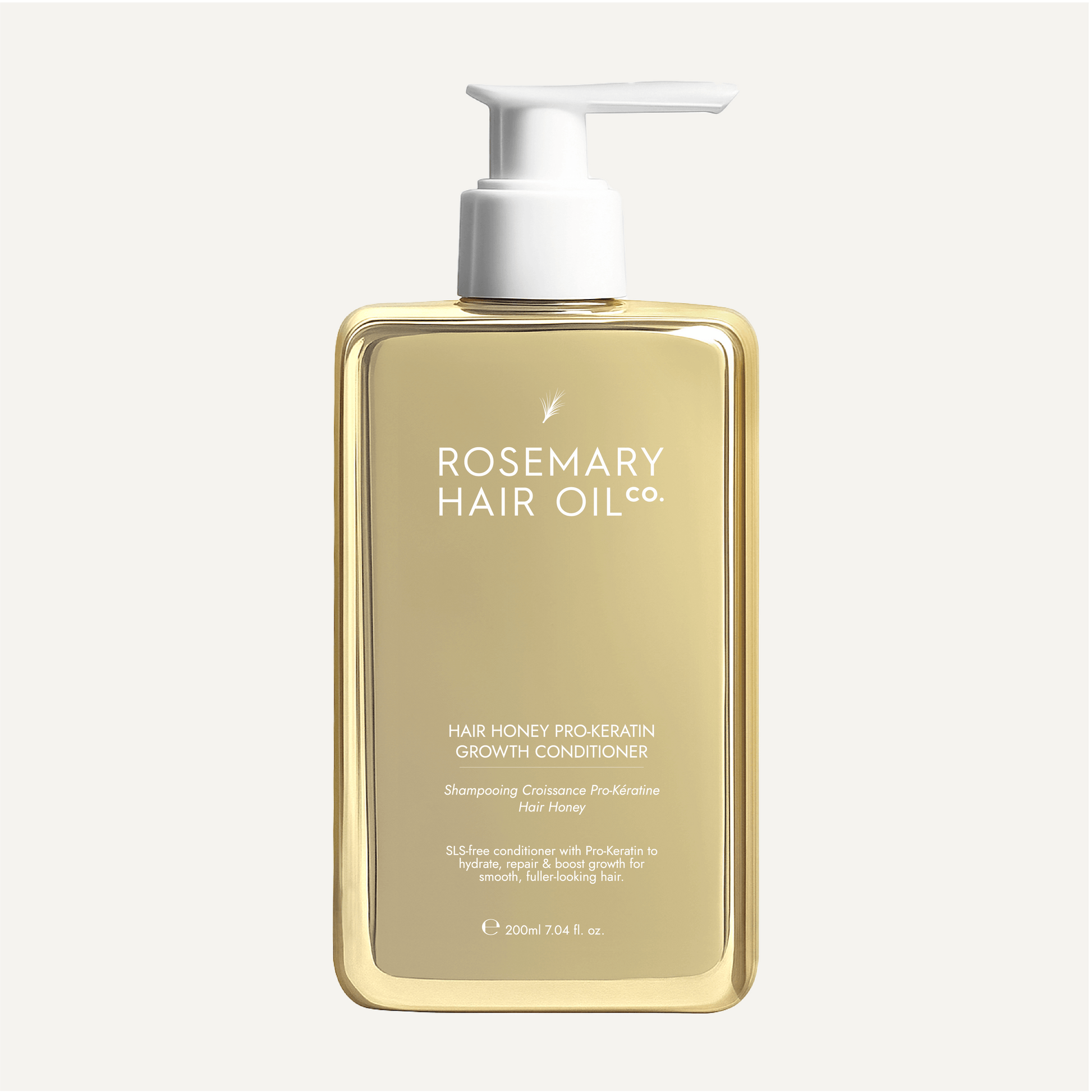 Gold bottle of Rosemary Hair Oil Co. hair product on a white background. Pro-keratin growth conditioner with honey to smooth, strengthen and soften hair