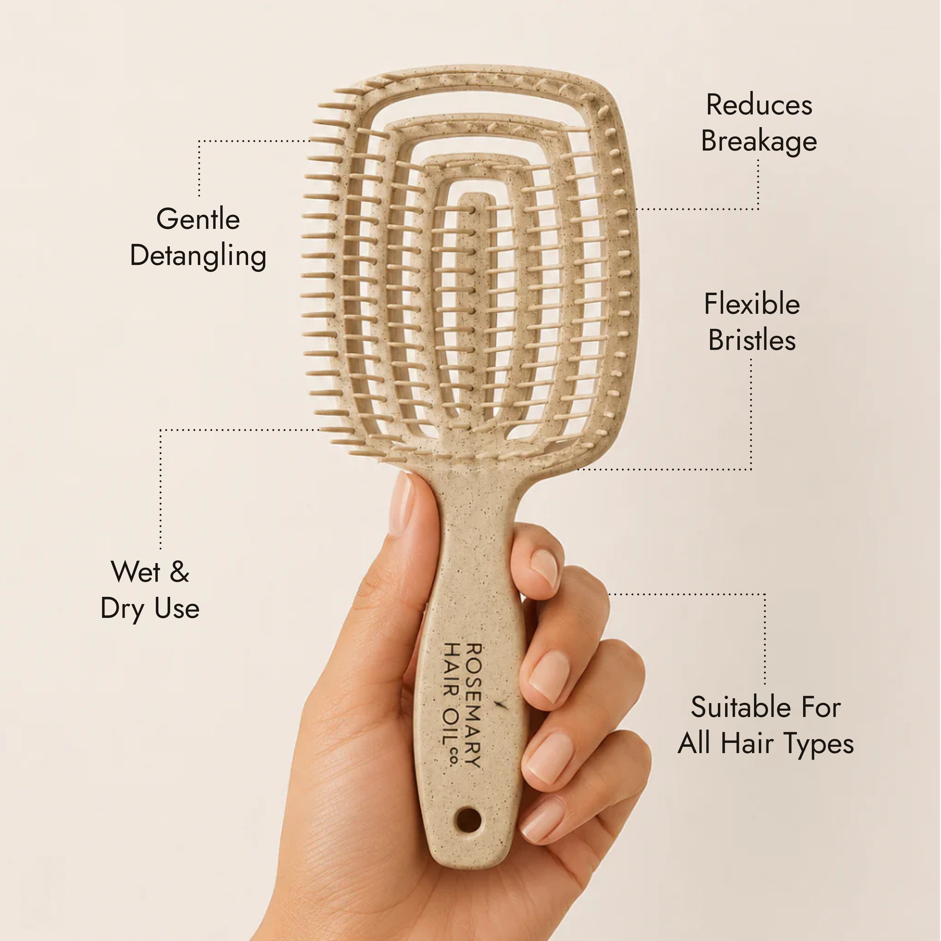 Beige hairbrush with 'Rosemary Hair Oil Co.' branding on a beige background, detangle brush, tangle teaser, flexi brush, benefits