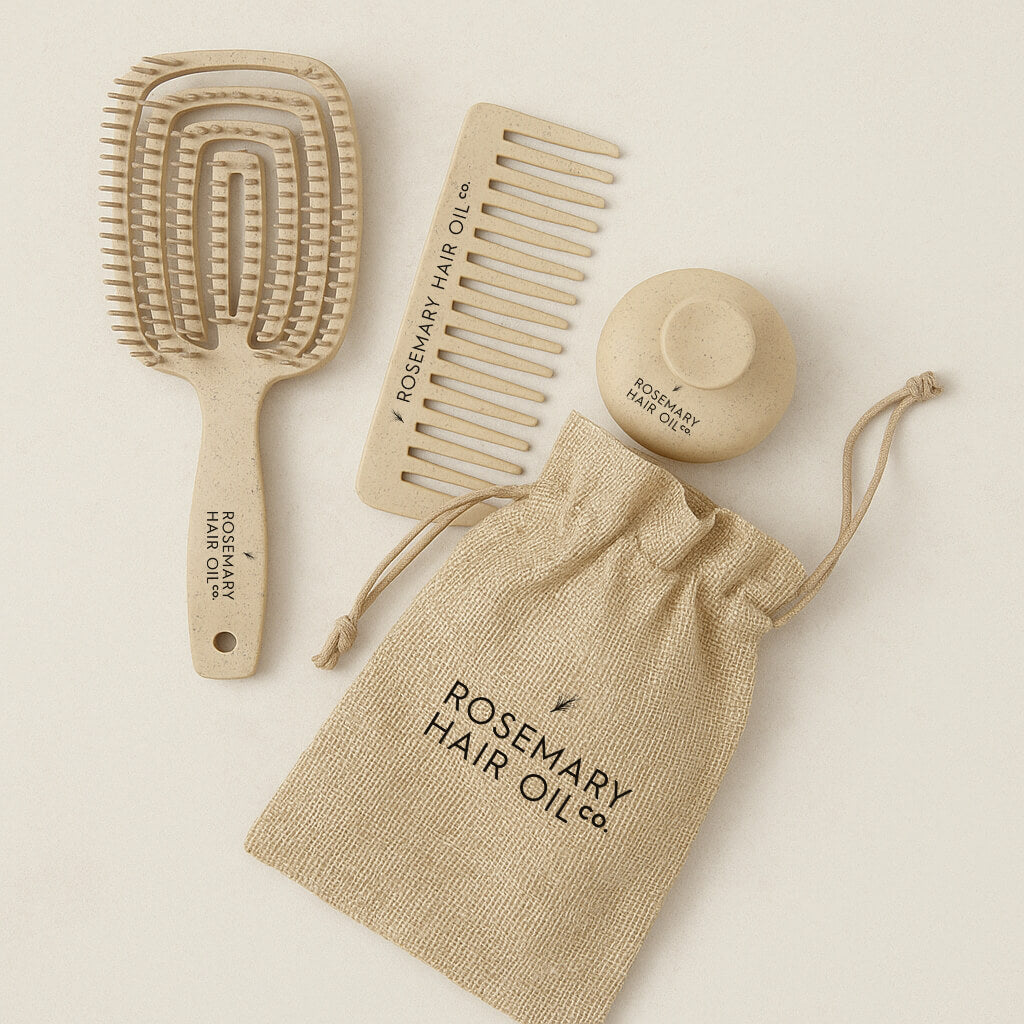 Set of wooden hairbrushes and comb with a pouch labeled 'Rosemary Hair Oil' on a beige background. Rosemary Hair Oil Co Hair Growth Accessories Set featuring scalp massage brush, wide-tooth comb and storage pouch