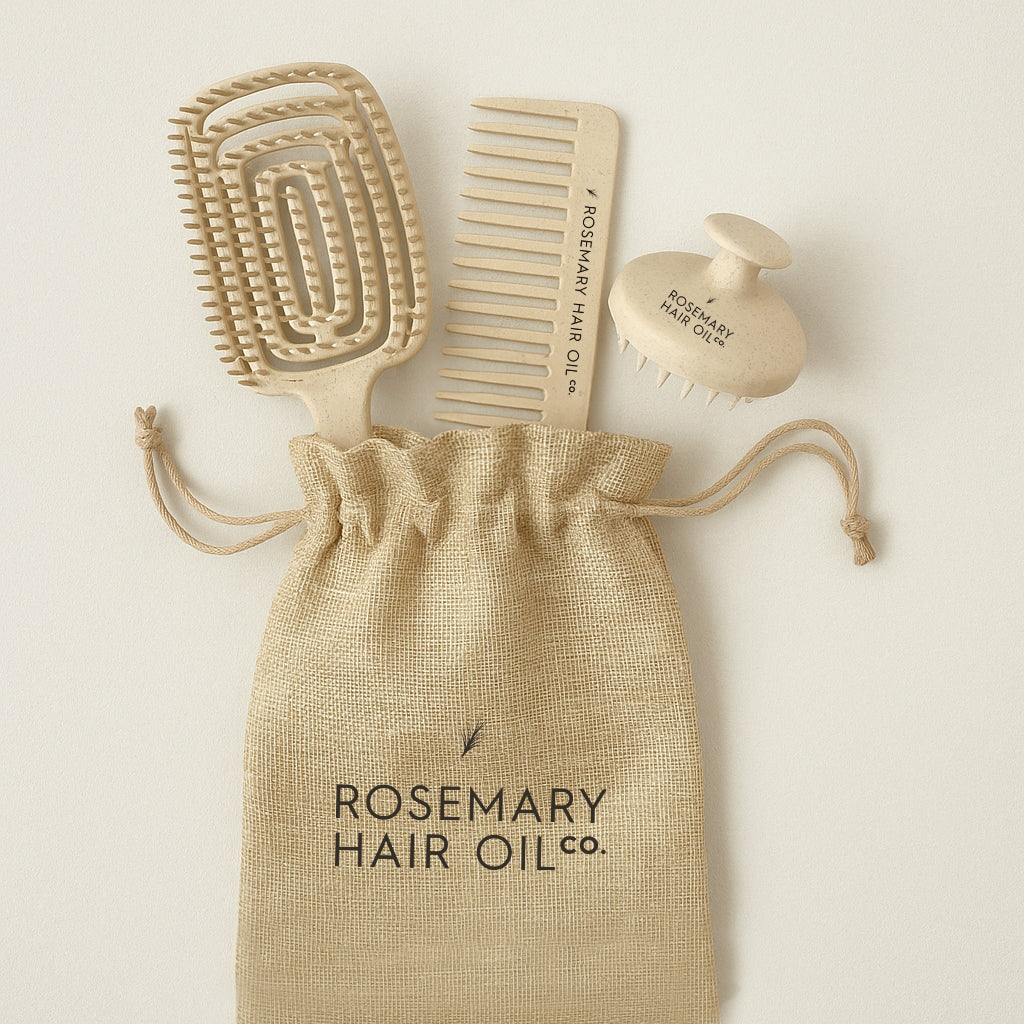 Set of hair care tools including a brush, comb, and bottle labeled 'Rosemary Hair Oil Co.' on a beige background. Rosemary Hair Oil Co Hair Growth Accessories Set featuring scalp massage brush, wide-tooth comb and storage pouch