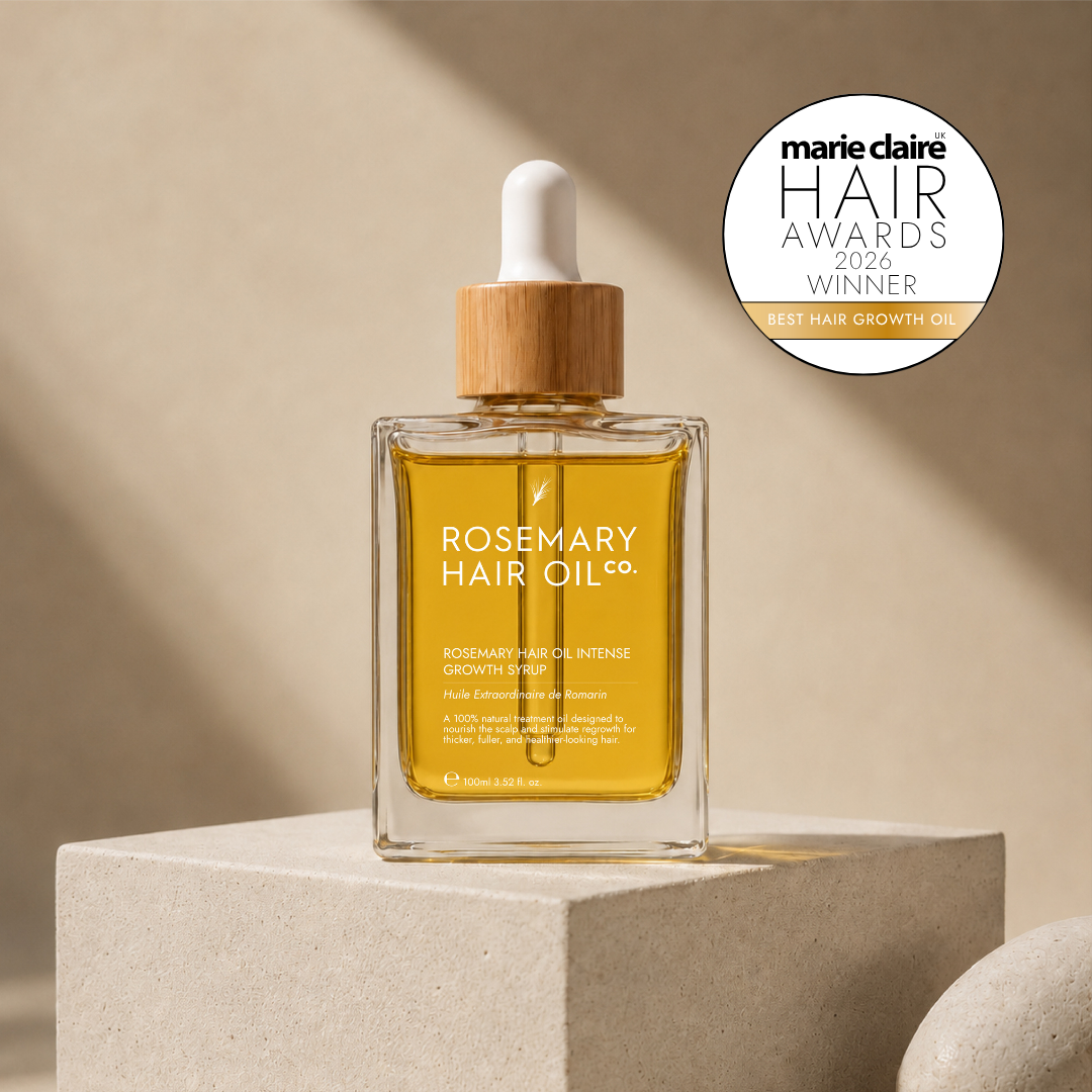 Rosemary hair oil bottle with dropper on a beige background, featuring Marie Claire Hair Awards 2026 winner badge. Rosemary hair oil, intense growth syrup, hair growth, rosemary oil, healthier, fuller-looking hair, castor oil, sunflower seed oil, stimulate, regrowth, hair thinning, natural, best hair growth oil 